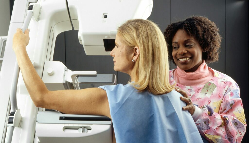 A woman getting a mammogram.